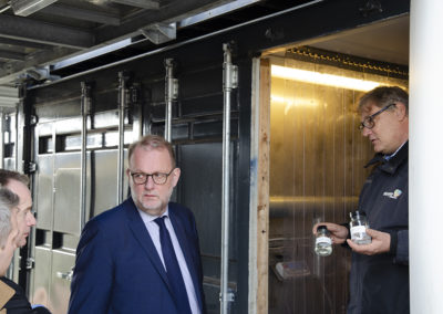 At the CBS1 facility, product delivery part. From left: Thomas Helmer Pedersen; Jacob Stoustrup, Lars Christian Lilleholt, Steen B. Iversen (showing sustainable fuels produced from biomass). Credits: AAU